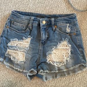 Short jean shorts with lace detail